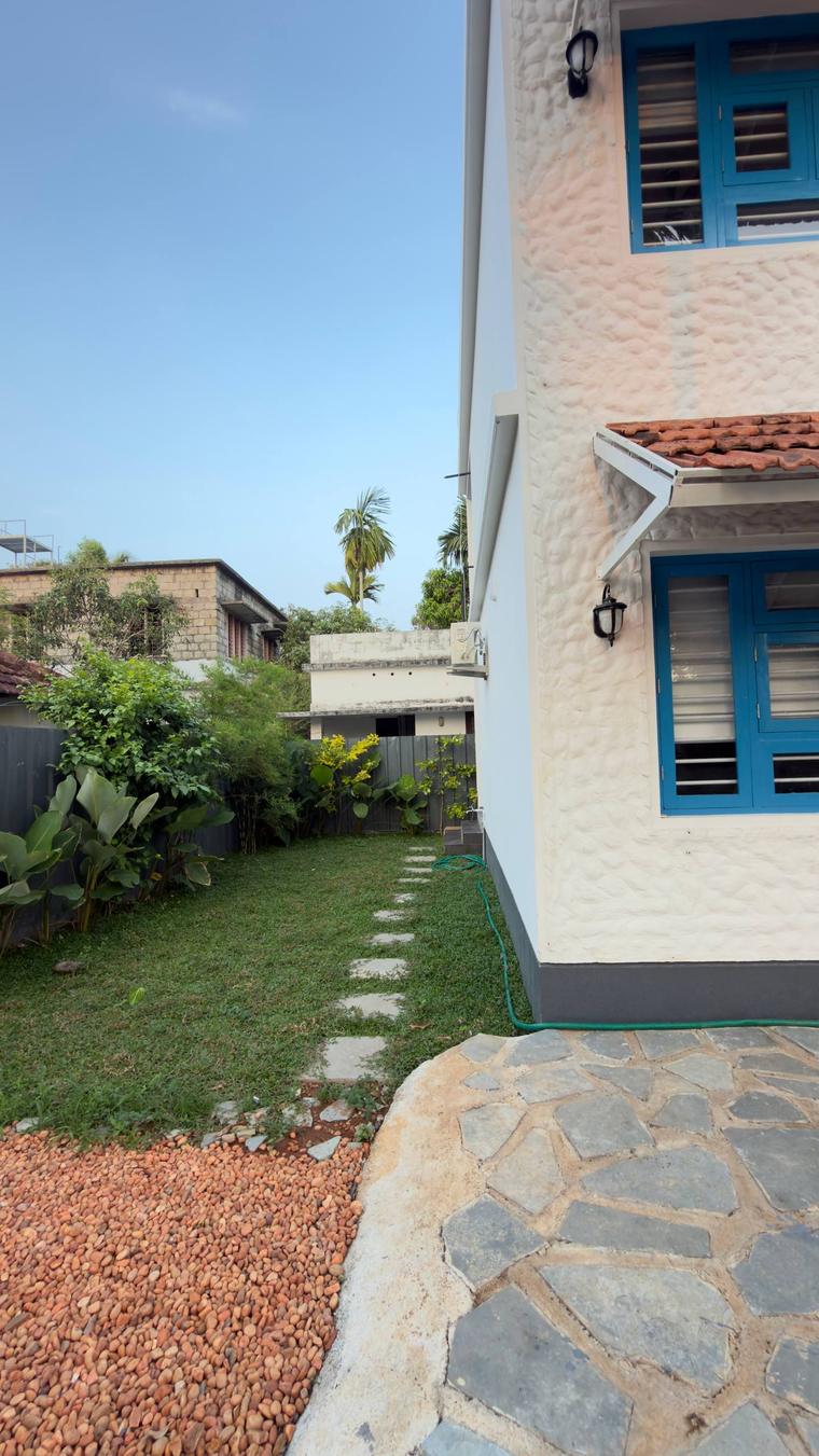 Blue Beach side elevation with stone paving and planting